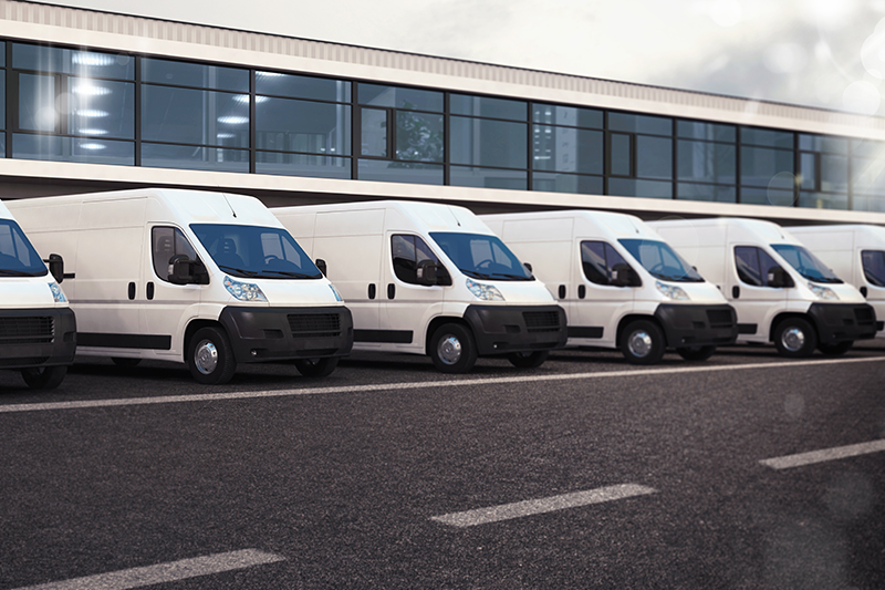 Row of telematics equipped white vans 