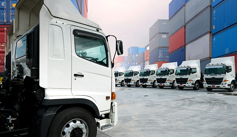 Row of  telematics equipped trucks at a container port