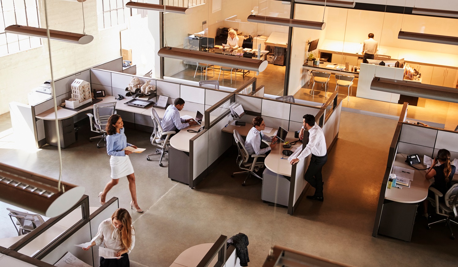 Image of office at work with engaged employees